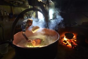 Cheesemaking-in-a-big-pot-with-fire-and-smoke